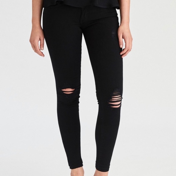 black pants with ripped knees